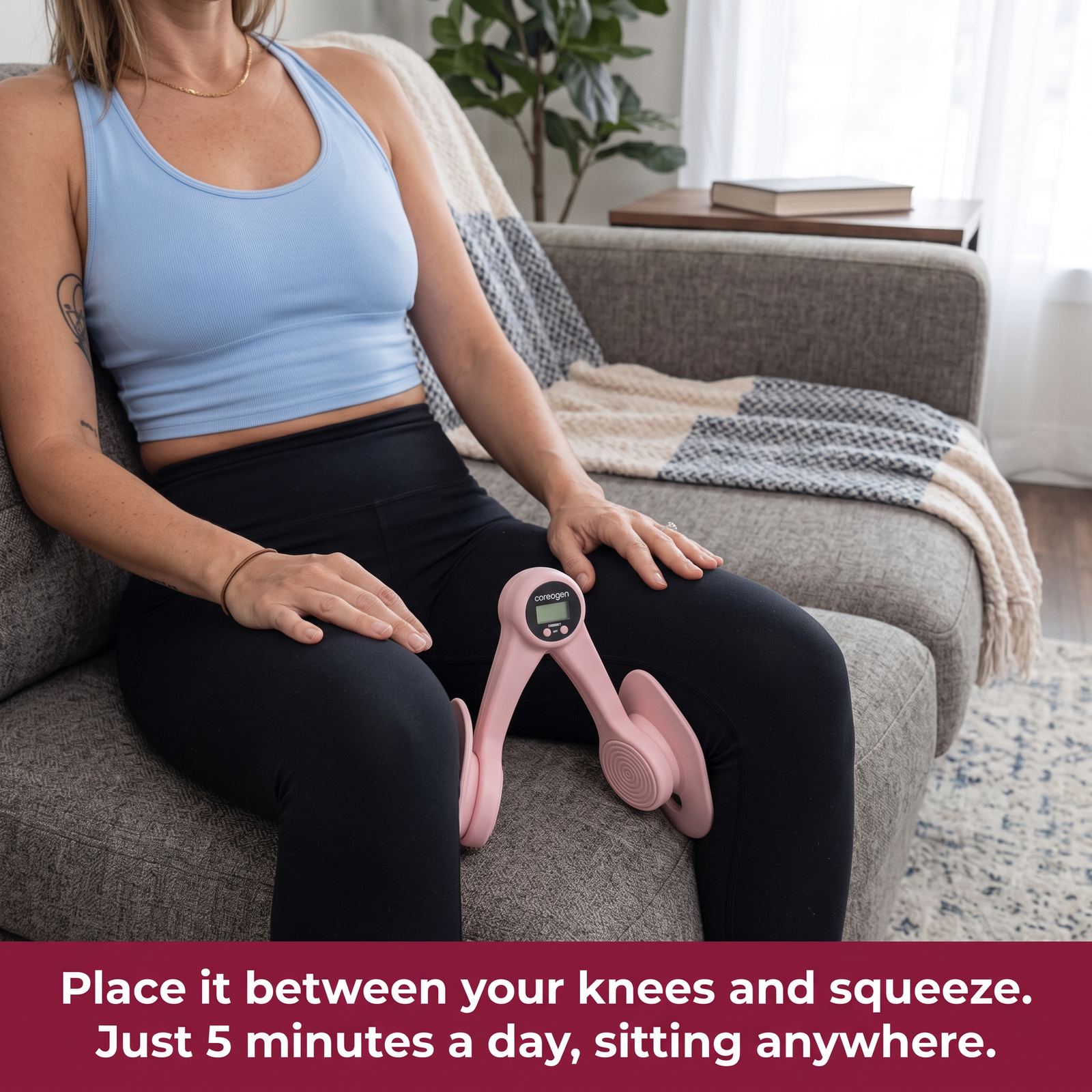 Woman seated at home squeezing the pink Coreogen trainer between her knees for five minutes a day.