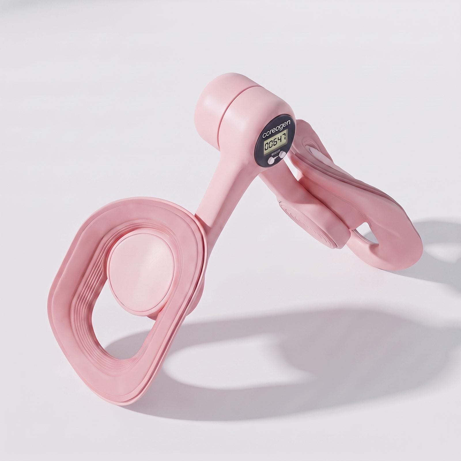 Top down studio shot of the pink Coreogen Pelvic and Thigh Trainer.